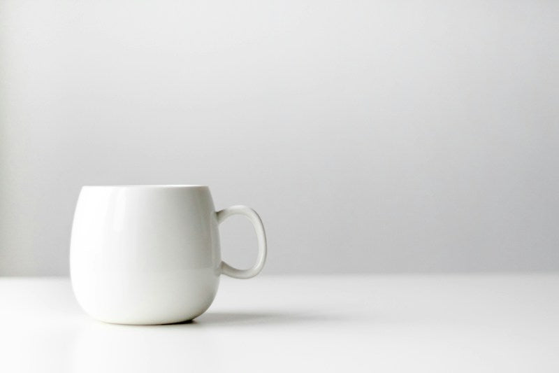 Plain white ceramic coffee mug sample